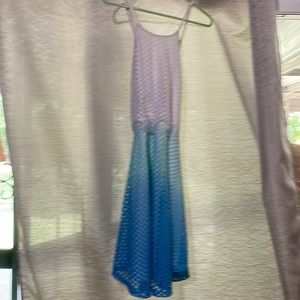 Short summer dress with spaghetti straps that cross in the back.